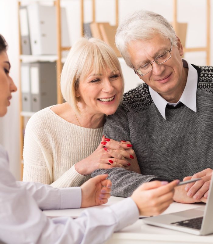 Couple discussing their solar rebate application with a consultant